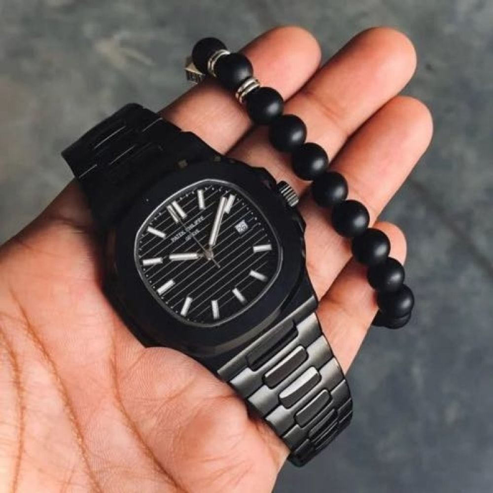 PATEK PHILIPPE NAUTILUS QUARTZ ( 050 )