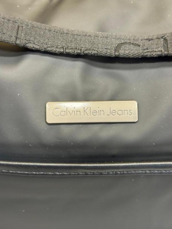 Calvin_Klein Black Travel Duffle Bag with Front Zip Pocket & Logo Detail (Z0610-Black)