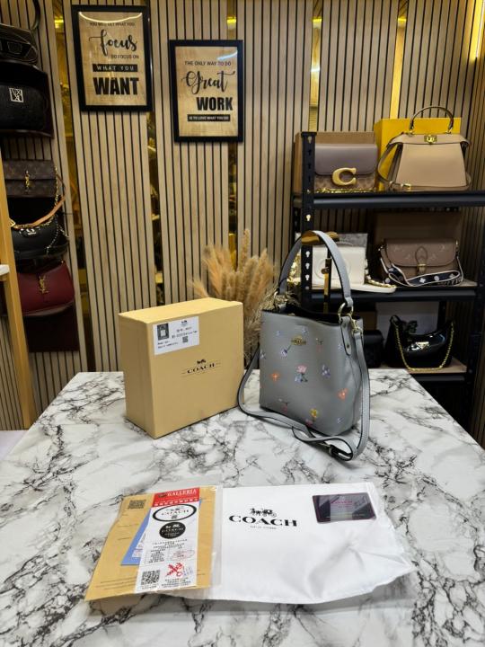 Coac_h Bucket Crossbody Bag With Signature Floral Print (Grey Flower)