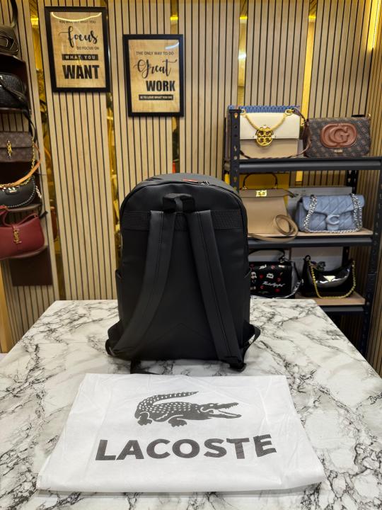 Lacost_e Bold Sporty Logo Design Premium Backpack With Dust Bag (Black-518-4)