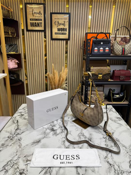 Guess Signature Crescent Hobo Shoulder Bag With Gold Chain (Stone Beige)