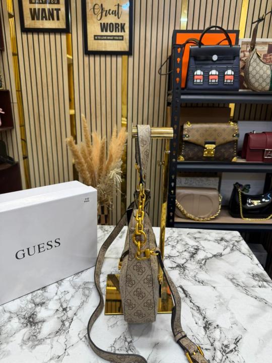 Guess Signature Crescent Hobo Shoulder Bag With Gold Chain (Stone Beige)