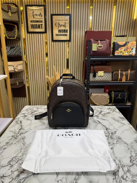 COAC_H LEATHER COURT WITH DUST BAG PREMIUM QUALITY BAGPACK (COFFEE)