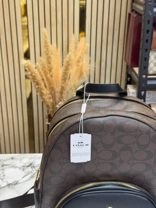 COAC_H LEATHER COURT WITH DUST BAG PREMIUM QUALITY BAGPACK (COFFEE)