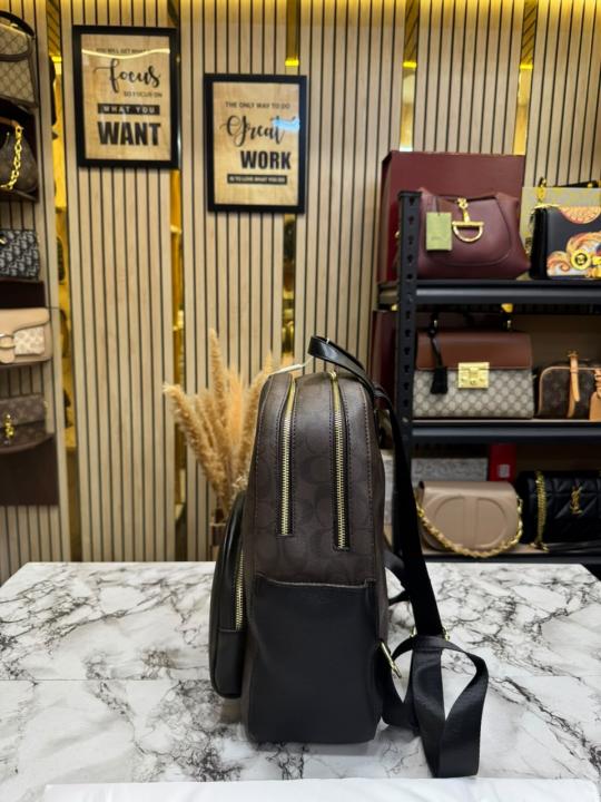 COAC_H LEATHER COURT WITH DUST BAG PREMIUM QUALITY BAGPACK (COFFEE)