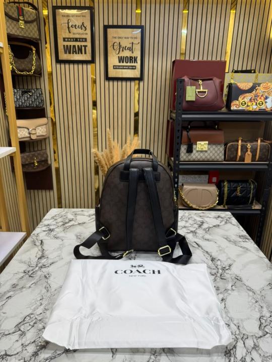 COAC_H LEATHER COURT WITH DUST BAG PREMIUM QUALITY BAGPACK (COFFEE)