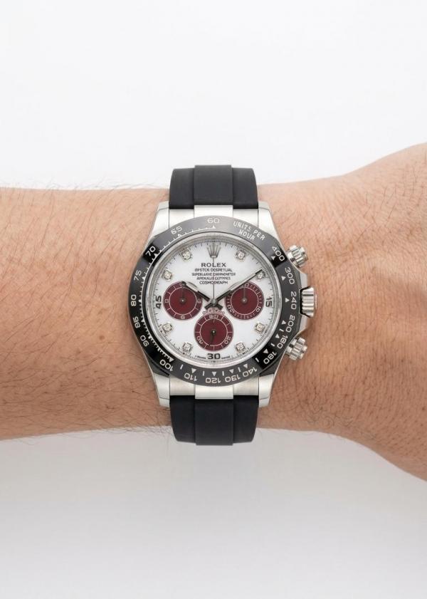Roleex Cosmograph Daytona chronograph white-and-red dial paired with a black rubber strap