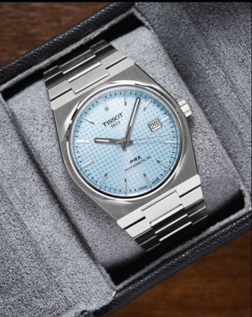 Tissot prx auto em 61